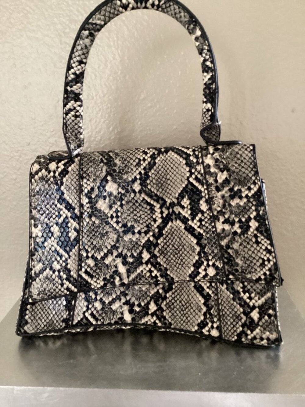 Black and white reptile purse